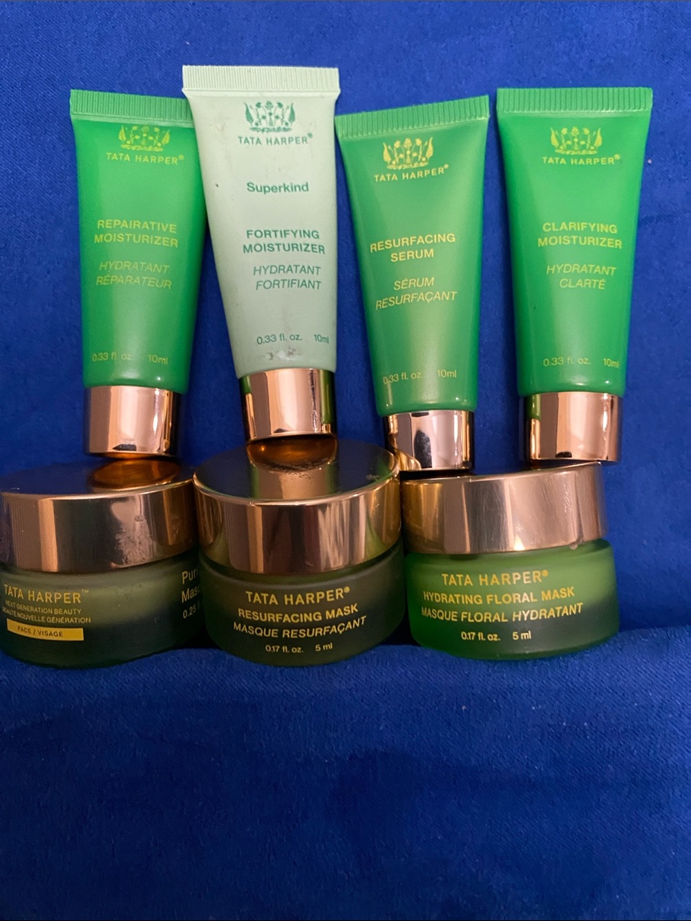 7 piece Tata Harper Green Travel Skincare Set with Rose-Gold Caps